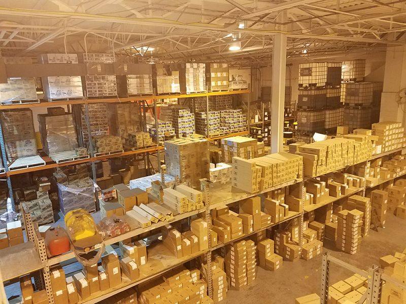 The Young's Lubricants warehouse filled with boxes of filters, batteries, wiper blades, washer fluid, anti-freeze, and Diesel Exhaust fluid.